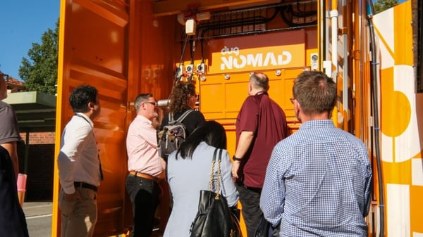 Delegates at the door of a DUG Nomad mobile data centre